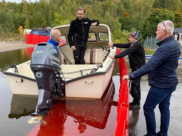 Boat in the flooded area barricaded using Boxwall® units